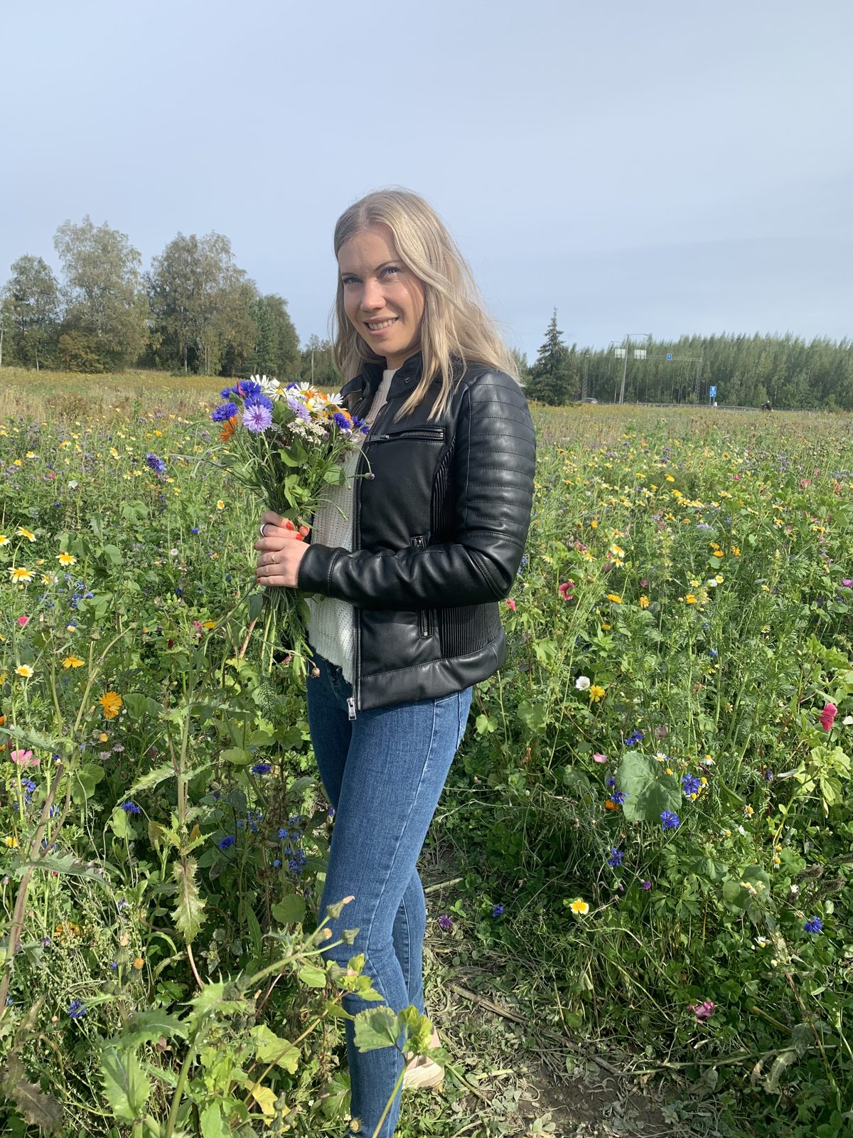 Jenni in a flower field in Finland